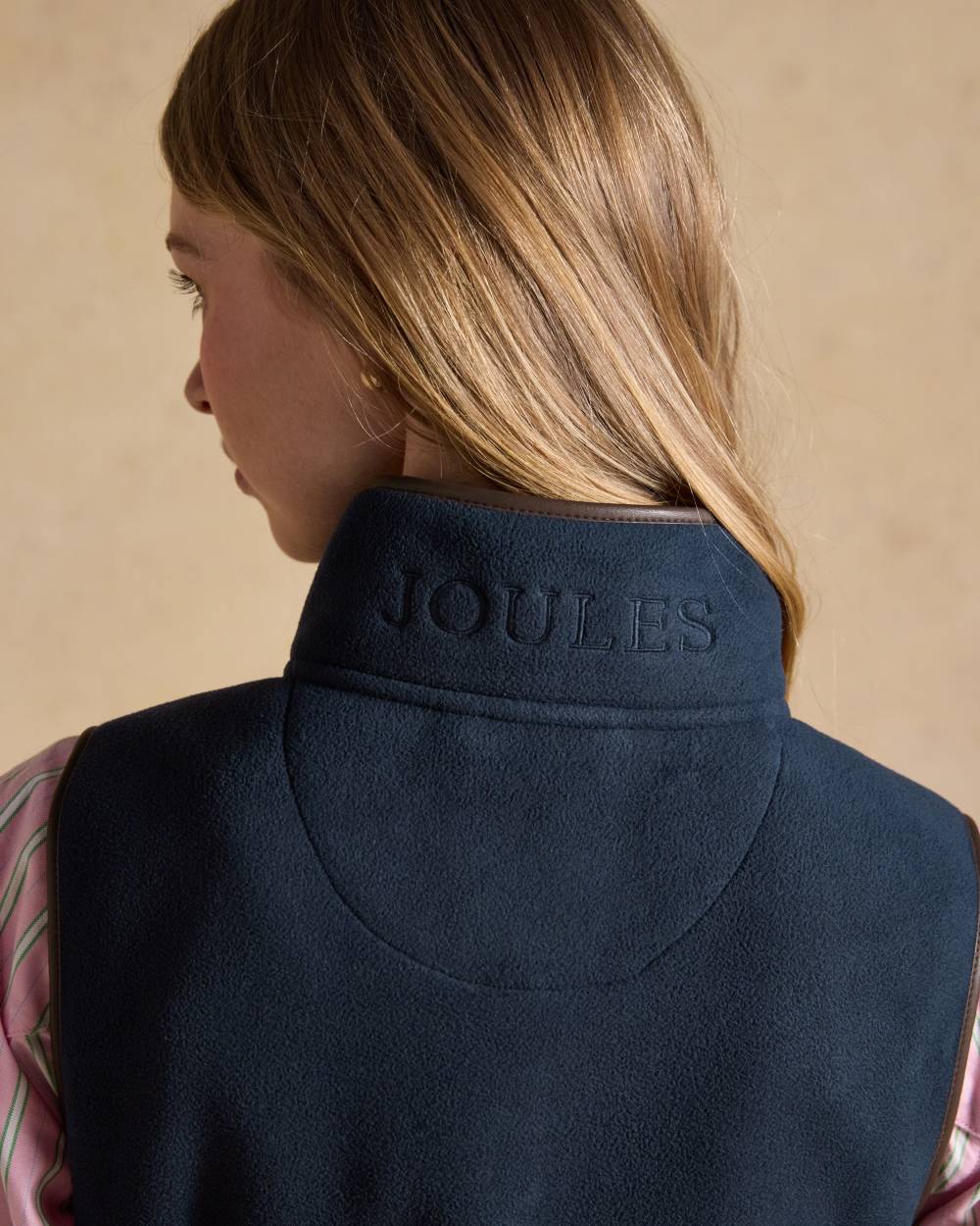 Navy Blue coloured Joules Heritage Longline Gilet on tan background 