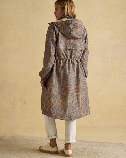 Henson Check Coloured Joules Holkham Waterproof Packable Raincoat With Hood on indoor background 