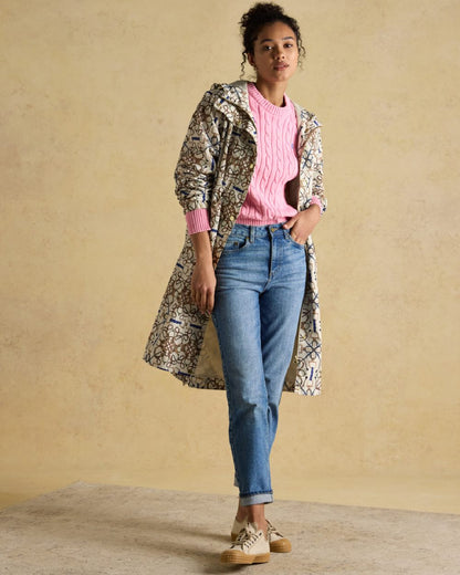 Stone Coloured Joules Holkham Waterproof Packable Raincoat With Hood on indoor background 