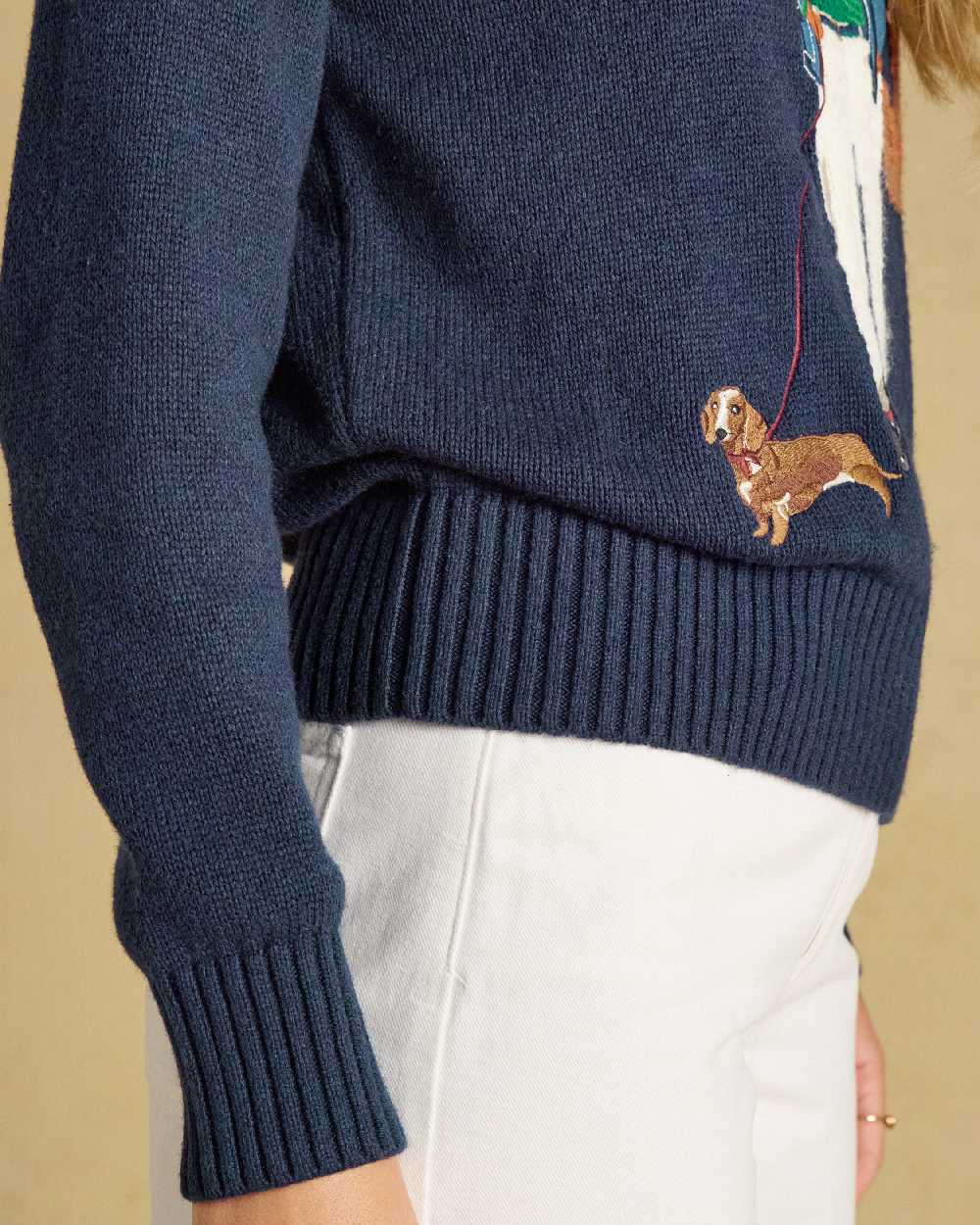 Navy Coloured Joules Jonty Intarsia Knit Jumper on beige background 