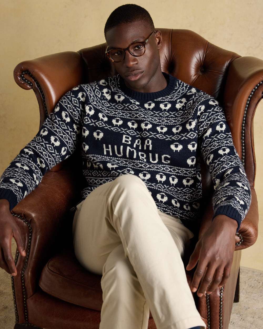 Navy Coloured Joules Mens Baa Humbug Intarsia Christmas Jumper on indoor background 