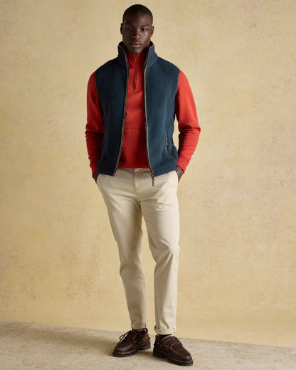 Navy Coloured Joules Mens Heritage Fleece Gilet on indoor background 