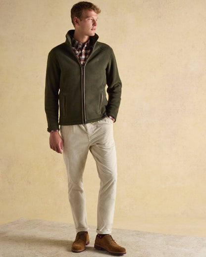 Dark Green Coloured Joules Mens Heritage Full Zip Through Fleece on indoor background 