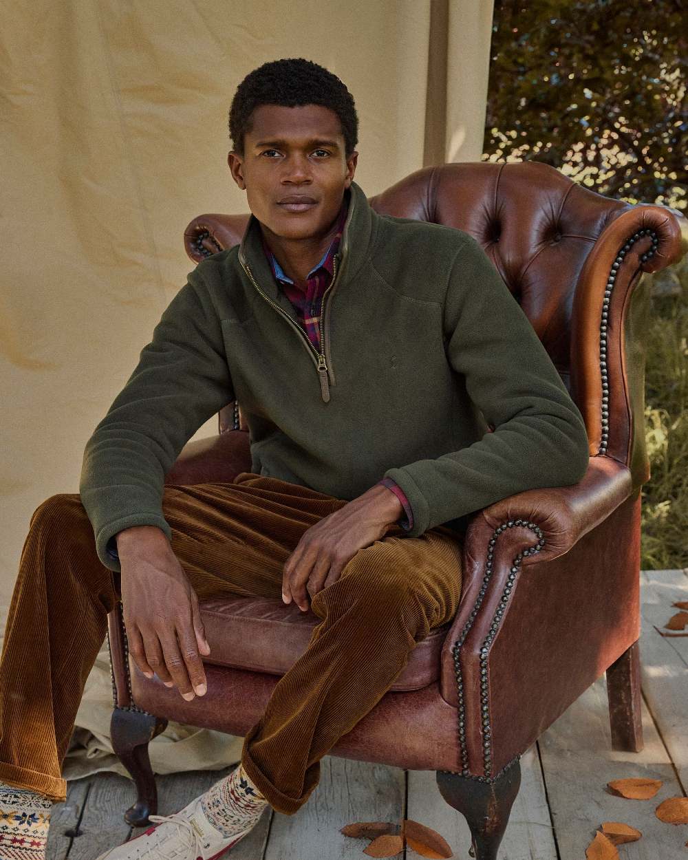 Dark Green Coloured Joules Mens Heritage Quarter Zip Fleece on outdoor background 