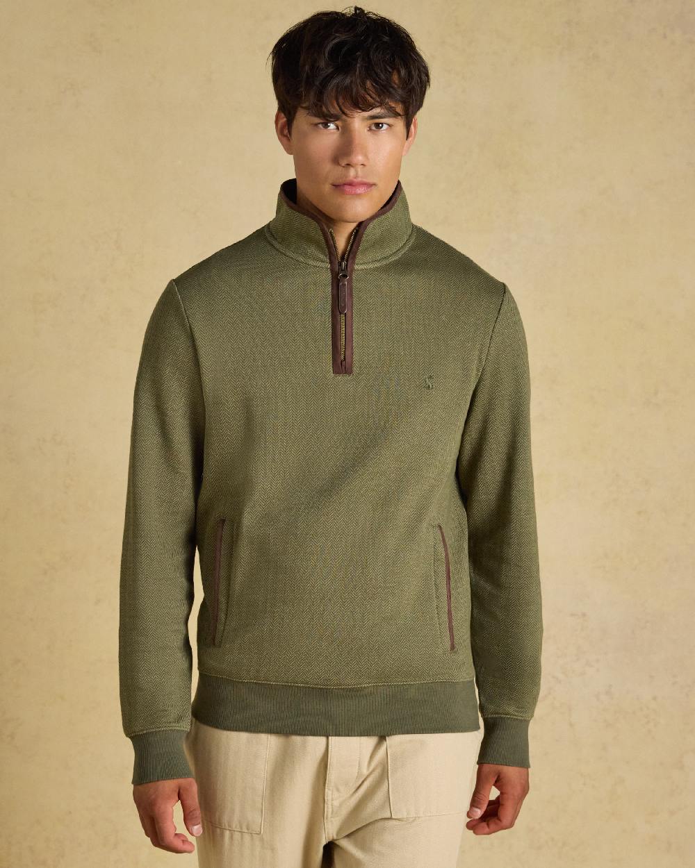 Green Coloured Joules Mens Herringbone Quarter Zip Sweatshirt on Beige Background 
