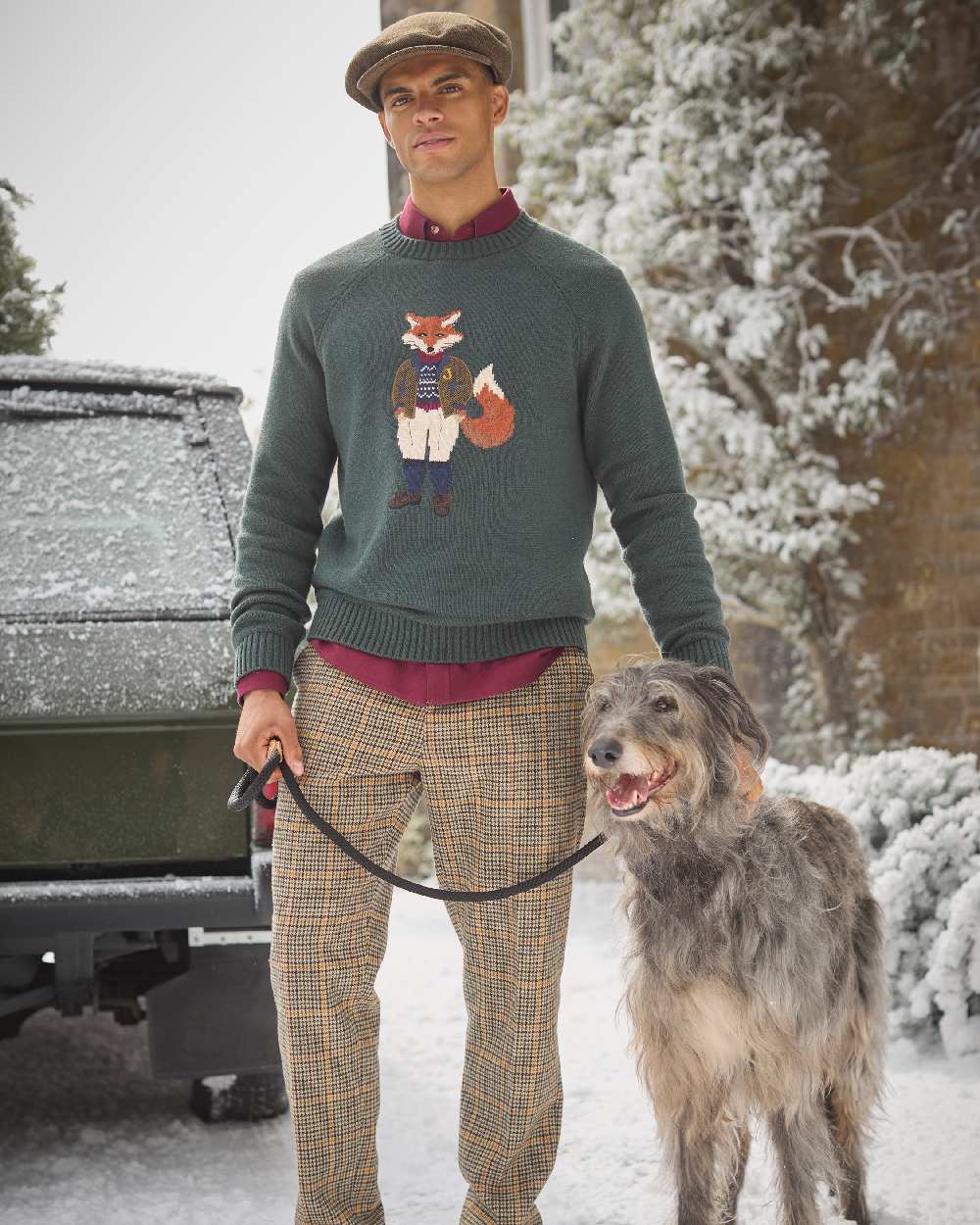 Green Coloured Joules Mens Jonty Intarsia Crew Knit Jumper on snow background 