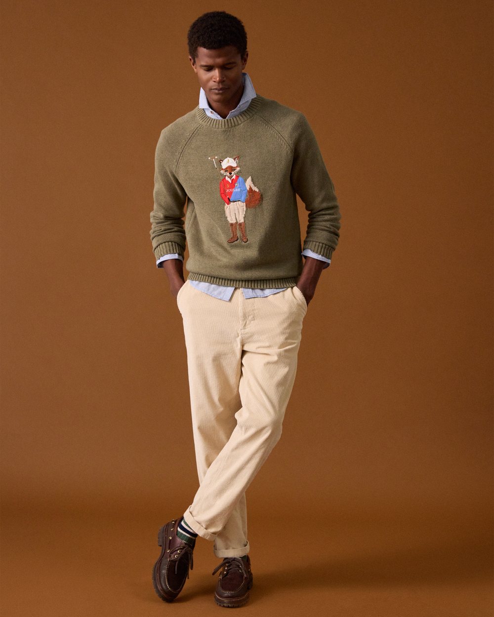 Khaki Green Coloured Joules Mens Jonty Intarsia Crew Knit Jumper on wall background 