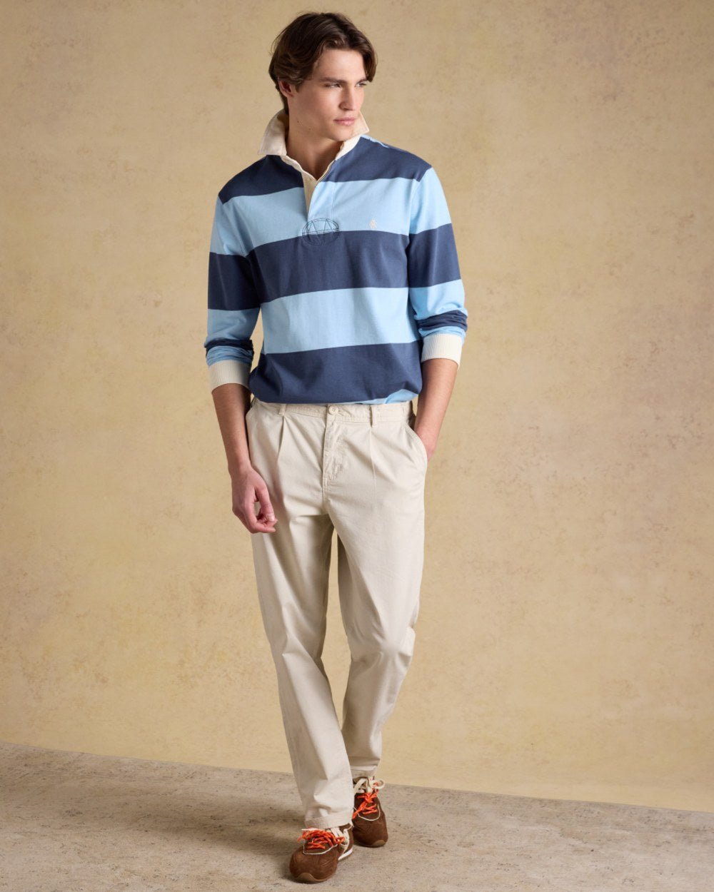 Blue Navy Coloured Joules Mens Onside Rugby Shirt on wall background 