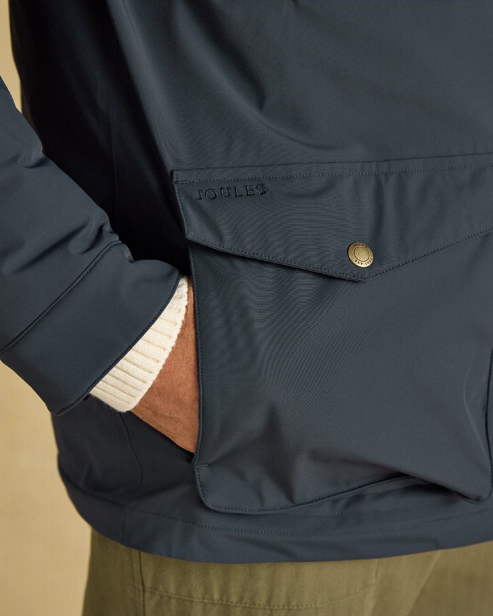 Navy Coloured Joules Mens Padded Waterproof Field Coat on Beige Background 