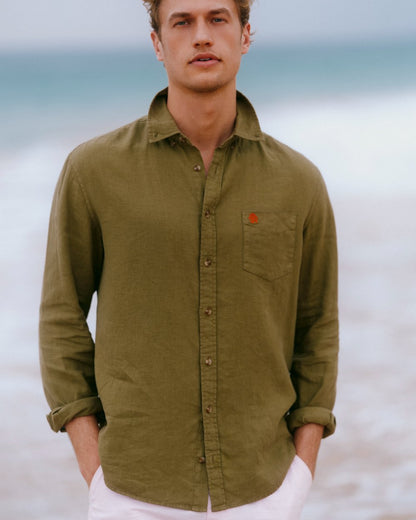 Khaki Green coloured Joules Mens Pure Linen Long Sleeve Classic Fit Shirt on sea background 