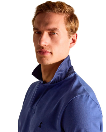 Blue coloured Joules Mens Woody Cotton Pique Polo Shirt on white background 