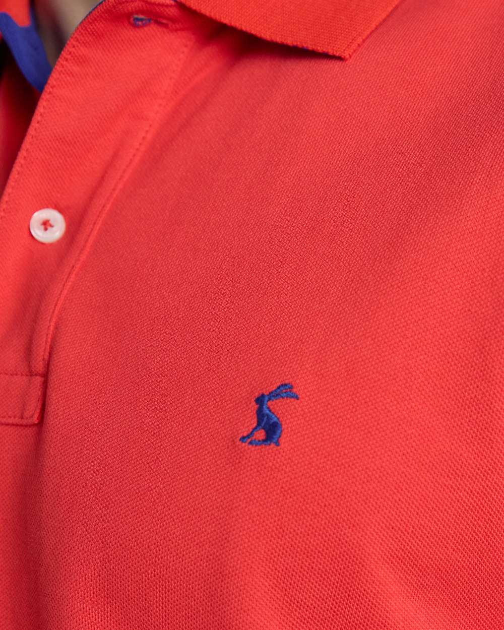 Red coloured Joules Mens Woody Cotton Pique Polo Shirt on white background 