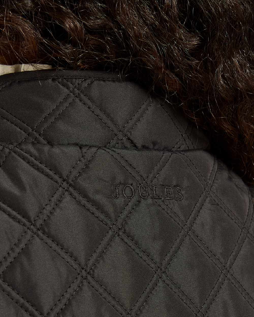 Black Coloured Joules Minx Showerproof Diamond Quilted Gilet on white background 
