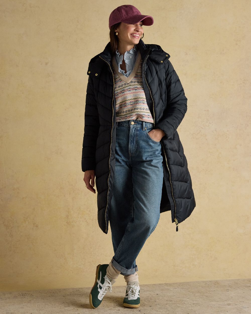 Dark Navy Coloured Joules Pembury Showerproof Longline Padded Coat on indoor background 