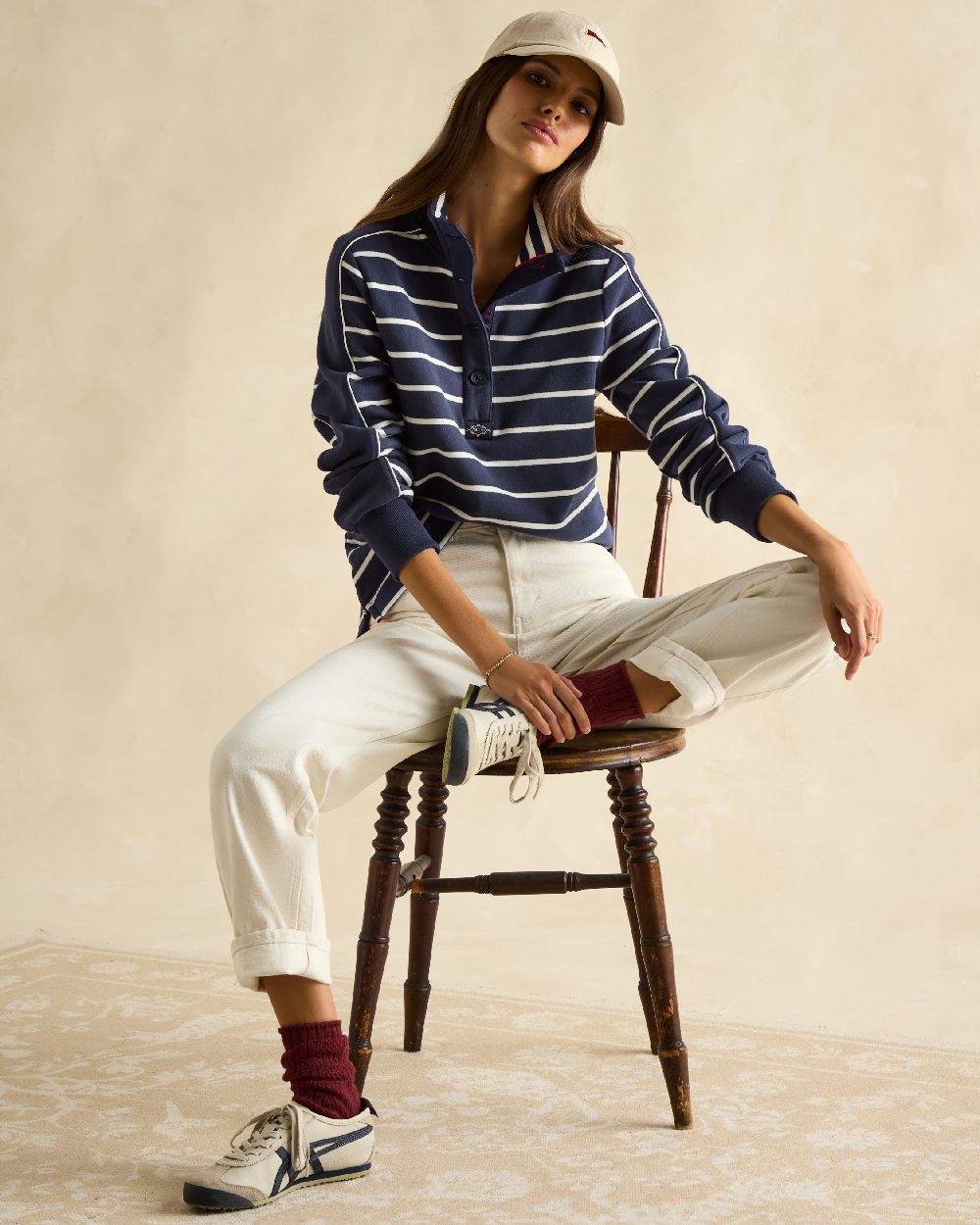 Navy Stripe coloured Joules Southwold Button Down Striped Sweatshirt on wall background 