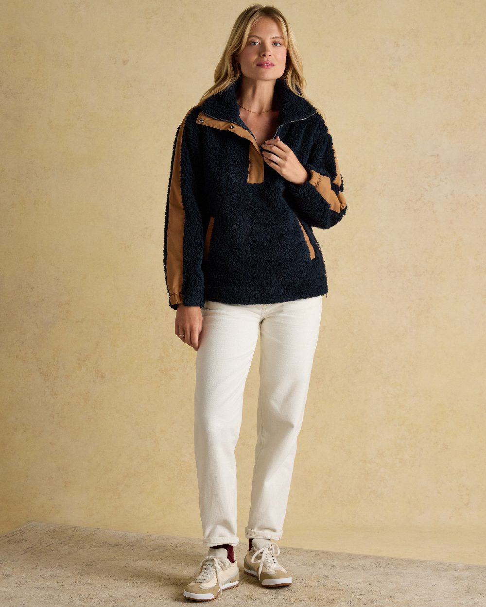 Navy Coloured Joules Tilly Half Zip Borg Fleece on indoor background 