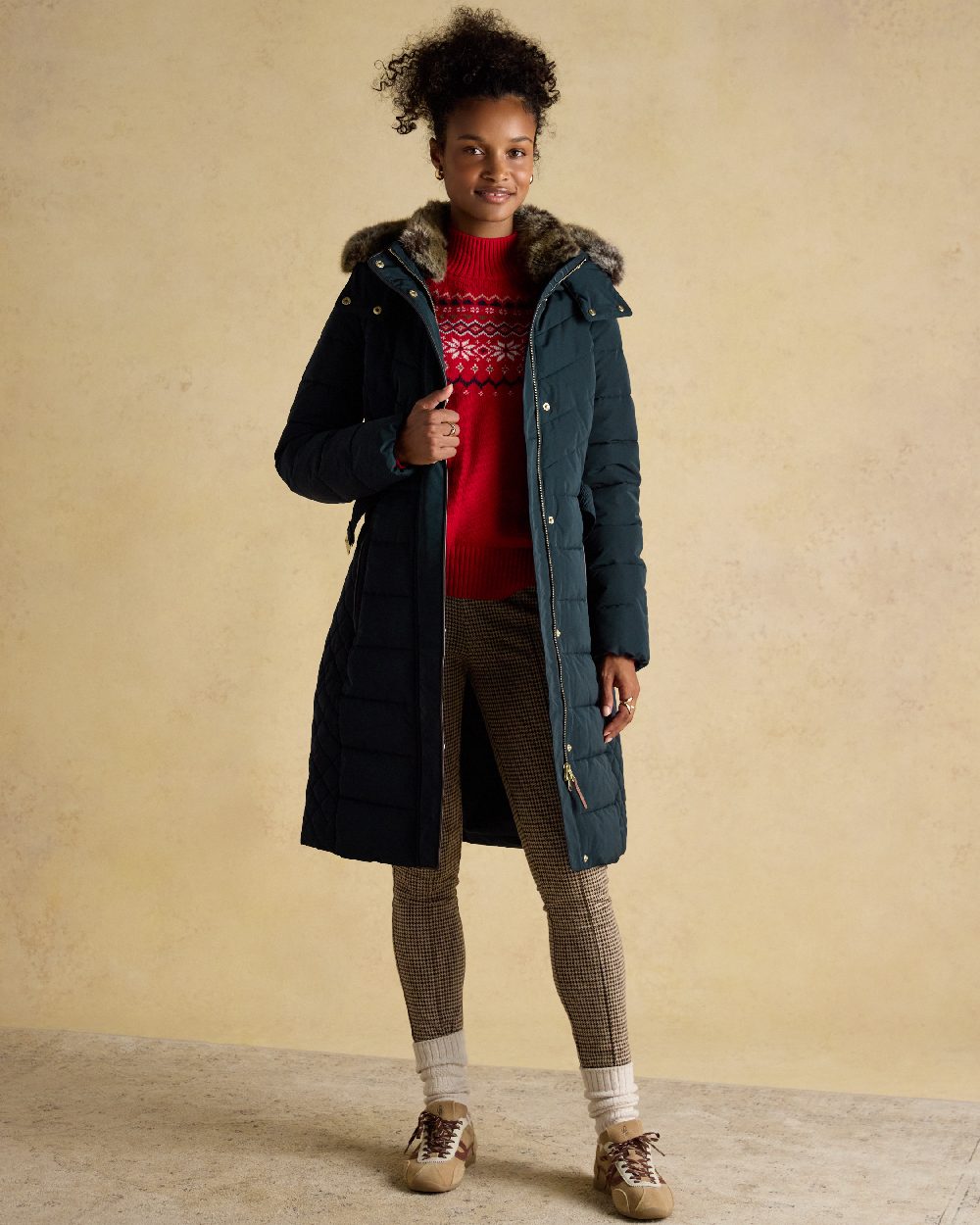 Navy Coloured Joules Womens Aspen Long Showerproof Padded Coat on indoor background 