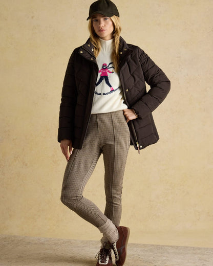 Brown Coloured Joules Womens Aspen Showerproof Padded Coat on wall background 