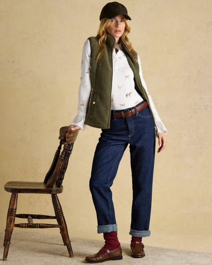 Khaki Green coloured Joules Womens Borg Heritage Fleece Gilet on wall background 