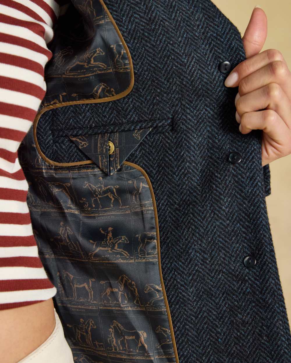 Navy coloured Joules Womens Canterly Tweed Hacking Jacket on indoor background 