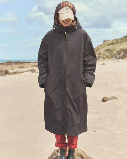 Chocolate Coloured Joules Womens Fleecelined Waterproof Coveralls on sand background 