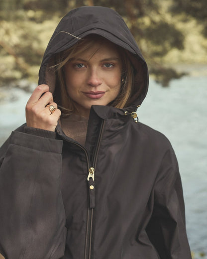 Chocolate Coloured Joules Womens Fleecelined Waterproof Coveralls on lake background 