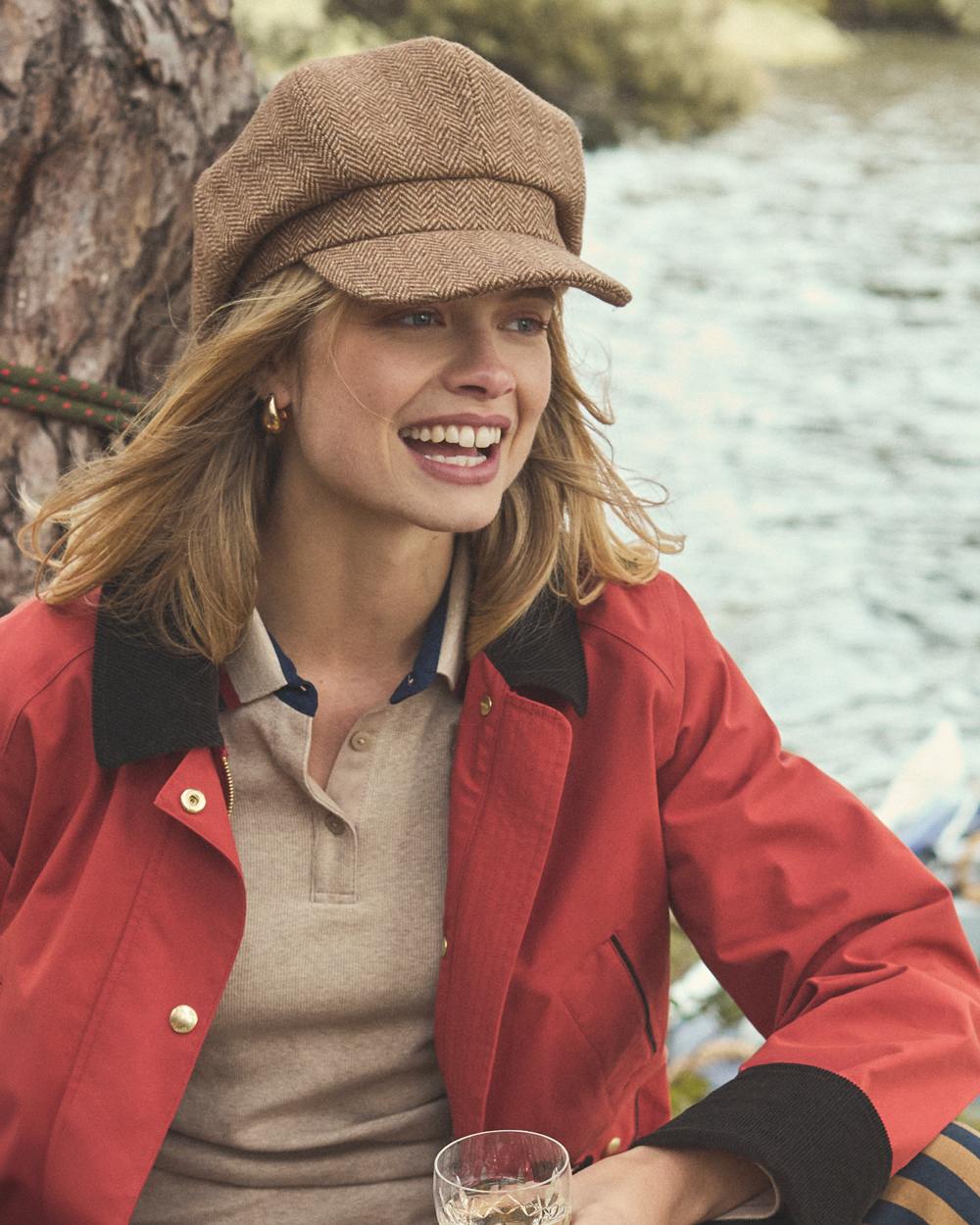 Tan Brown Coloured Joules Womens Elvaston Baker Boy Hat on lake background 