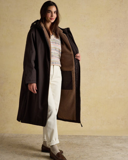 Chocolate Coloured Joules Womens Fleecelined Waterproof Coveralls on indoor background 