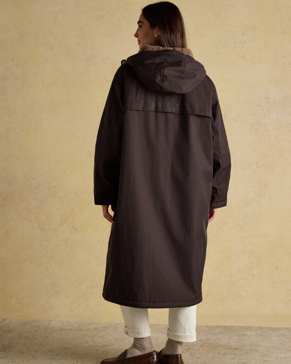 Chocolate Coloured Joules Womens Fleecelined Waterproof Coveralls on indoor background 