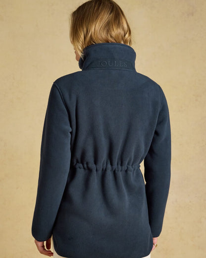 Navy coloured Joules Womens Full Zip Longline Fleece Jacket on indoor background 