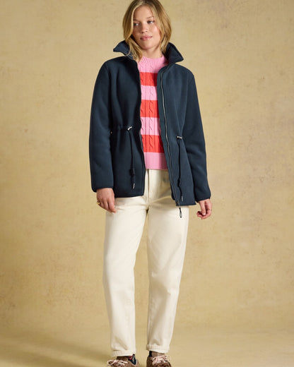 Navy coloured Joules Womens Full Zip Longline Fleece Jacket on indoor background 