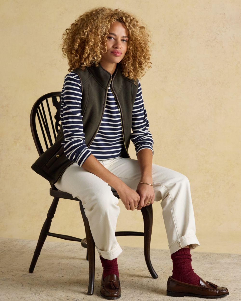 Navy White coloured Joules Womens Harbour Long Sleeve Striped Boat Neck Breton Top on wall background 