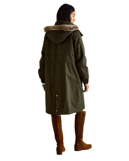 Khaki Green Coloured Joules Womens Harpsden Cosy Waterproof Fleece Lined Raincoat With Faux Fur Hood on white background 