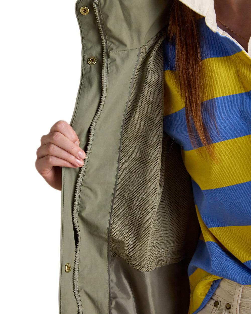 Khaki Green coloured Joules Womens Hensley Waterproof Longline Coat with Packable Hood on white background 