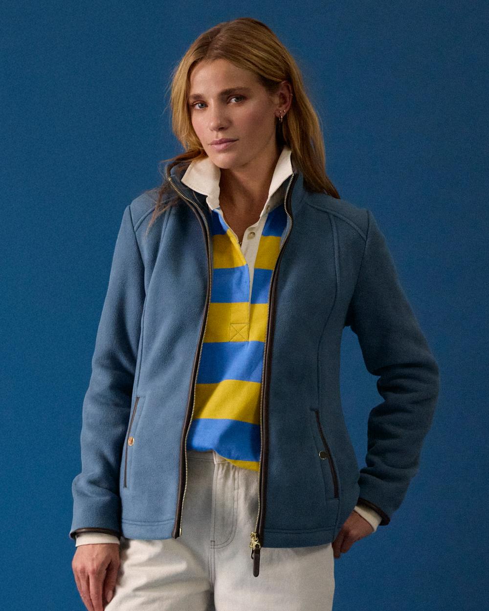 Blue Coloured Joules Womens Heritage Full Zip Through Fleece on wall background 