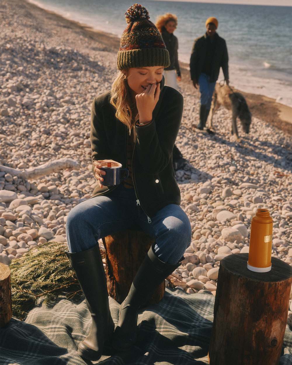 Green Coloured Joules Womens Heritage Full Zip Through Fleece on beach background 