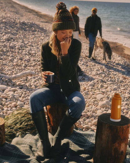 Green Coloured Joules Womens Heritage Full Zip Through Fleece on beach background 