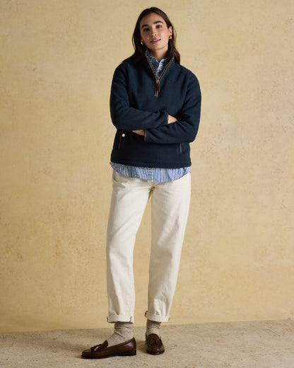 Navy Coloured Joules Womens Heritage Quarter Zip Fleece on indoor background 