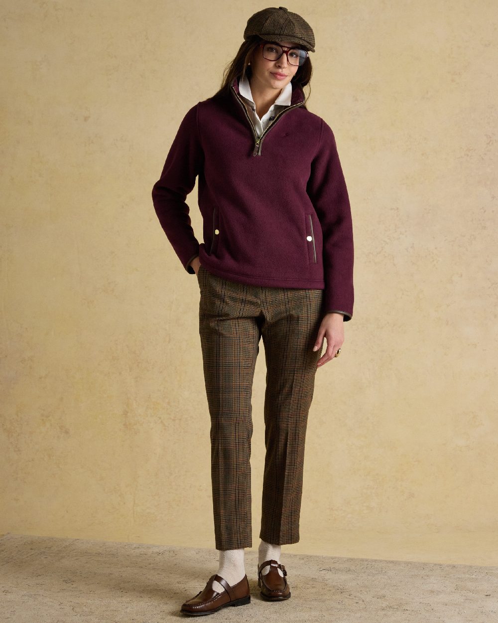Wine Red Coloured Joules Womens Heritage Quarter Zip Fleece on indoor background 