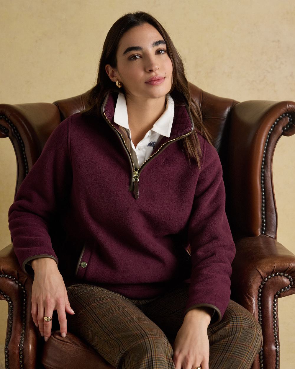 Wine Red Coloured Joules Womens Heritage Quarter Zip Fleece on indoor background 