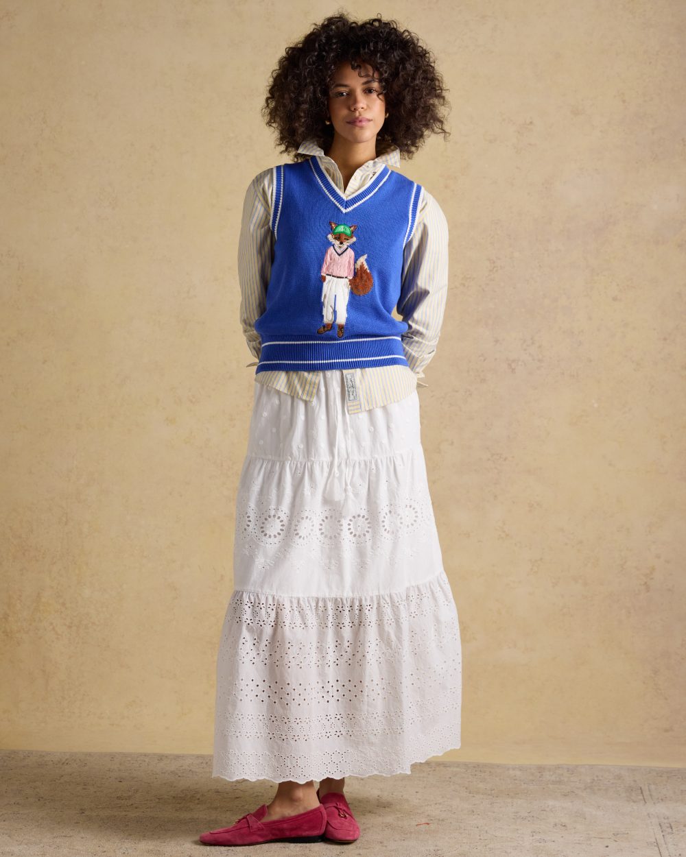 Blue coloured Joules Womens Jonty Fox Intarsia Knitted Cotton Vest on wall background 