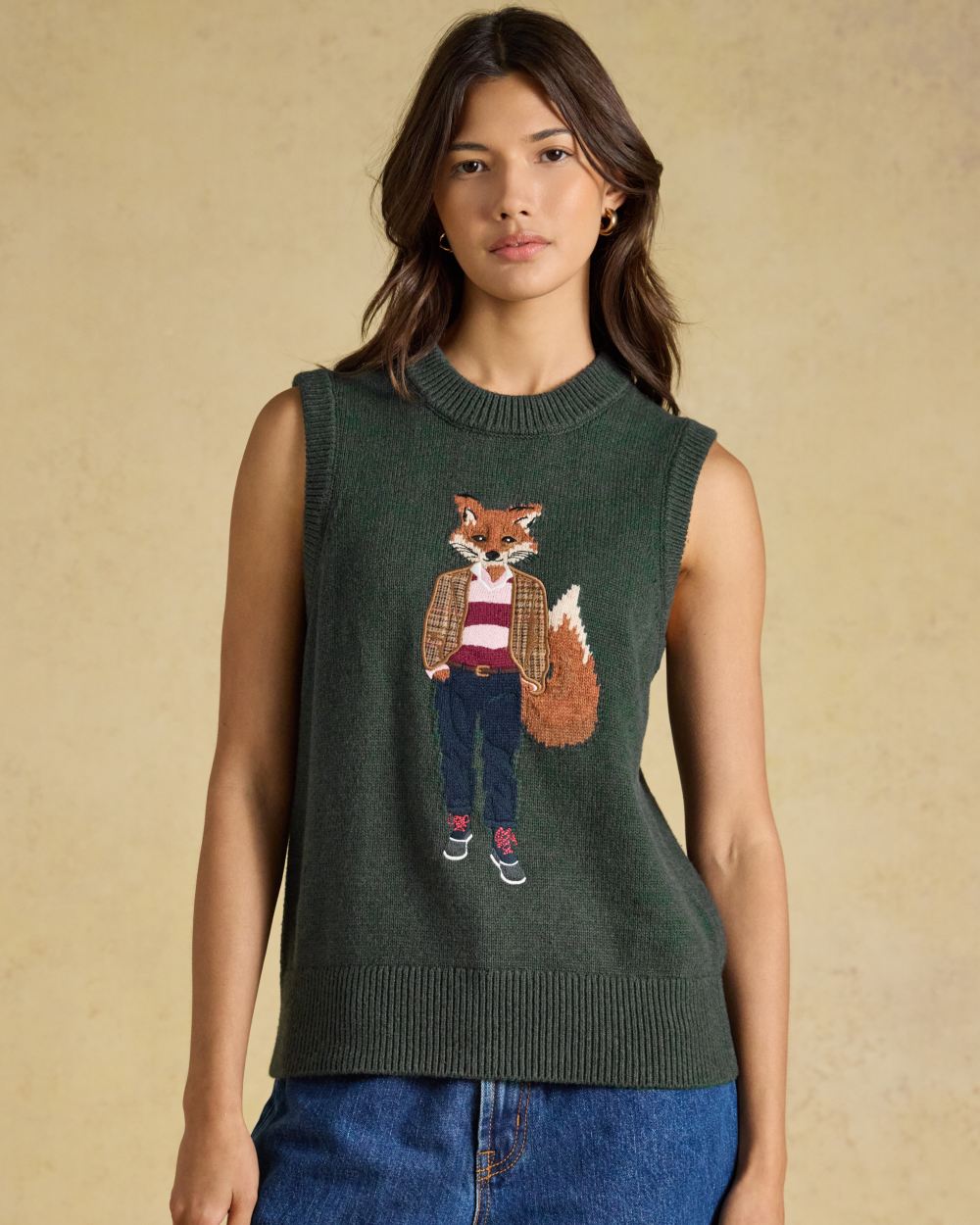 Green coloured Joules Womens Jonty Sleeveless Knitted Vest on indoor background 