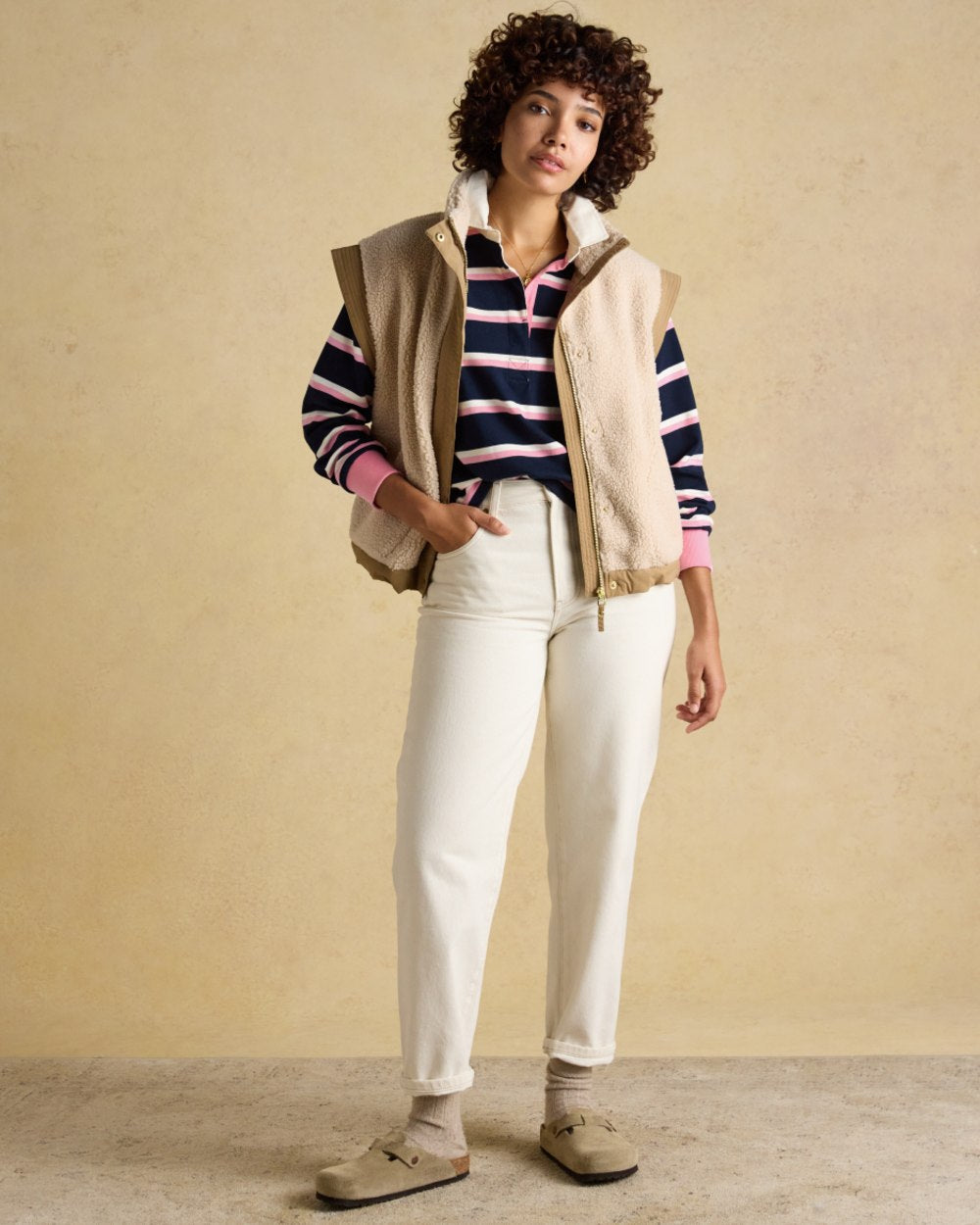 Navy Pink coloured Joules Womens Lara Long Sleeve Top on wall background 