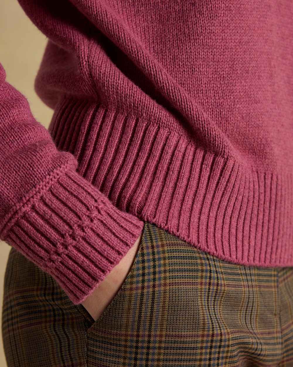 Pink coloured Joules Womens Rutland Intarsia Cotton Rich Knitted Jumper on wall background 