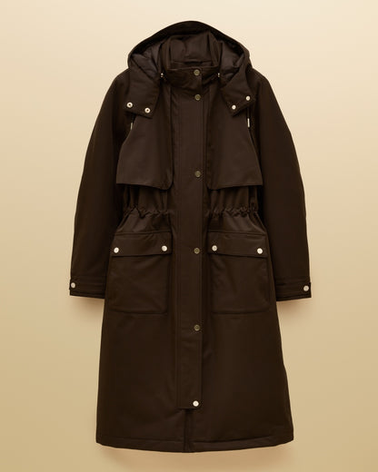 Chocolate Brown coloured Joules Womens Warmwell Waterproof Fleece Lined Raincoat on tan background 