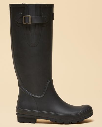 Black coloured Joules Womens Houghton Adjustable Tall Wellies on tan background 