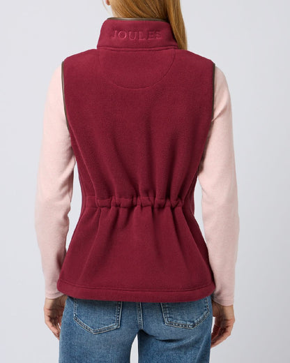Red coloured Joules Fairbourne Fleece Gilet on grey background 