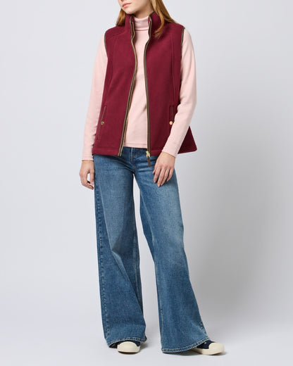 Red coloured Joules Fairbourne Fleece Gilet on grey background 