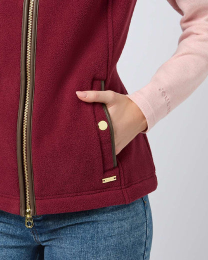 Red coloured Joules Fairbourne Fleece Gilet on grey background 