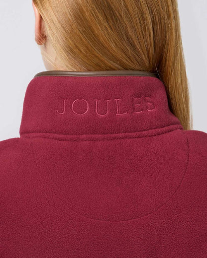 Red coloured Joules Fairbourne Fleece Gilet on grey background 